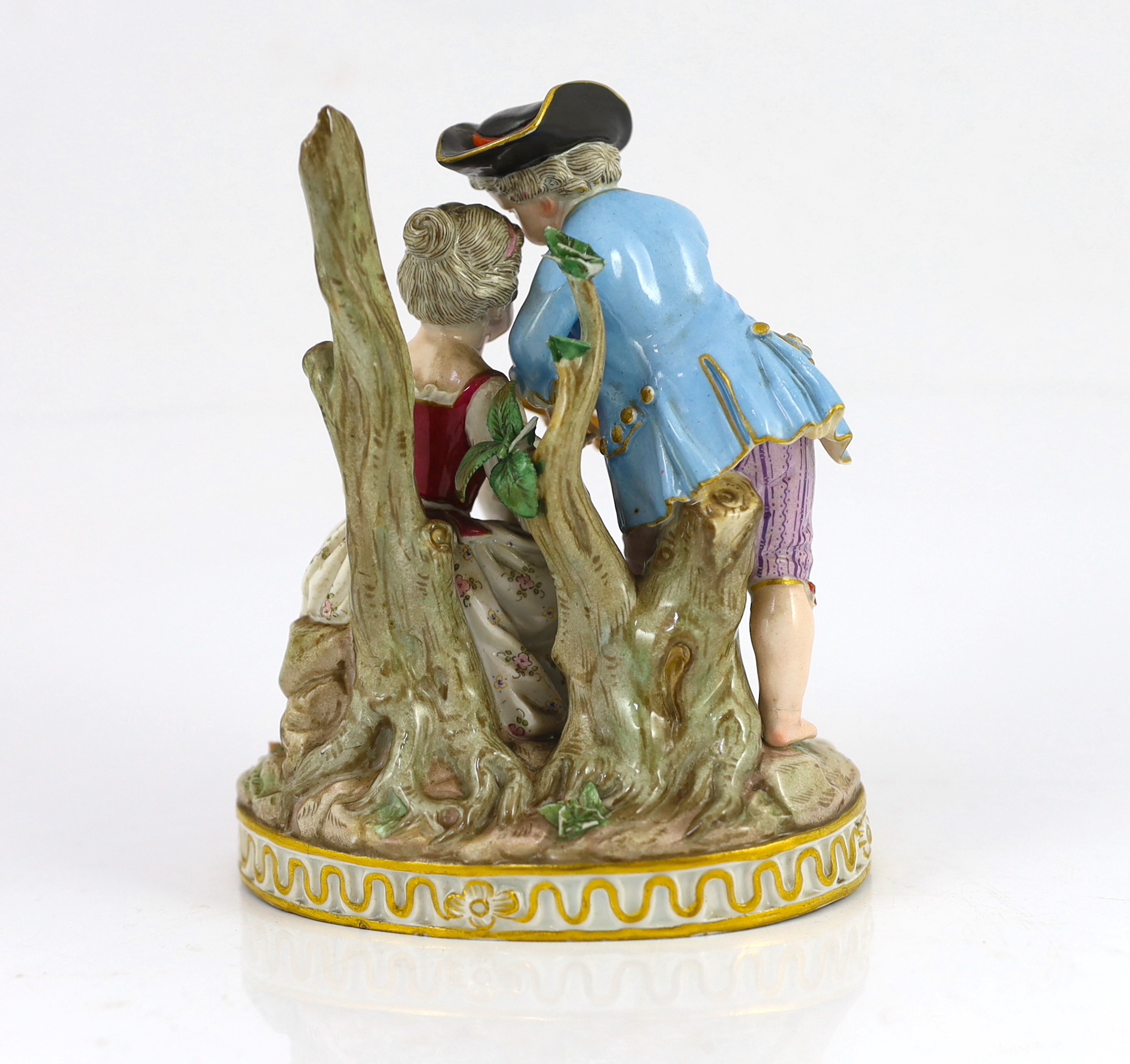 A Meissen group of a boy and a girl with a piccolo, 19th century, small losses